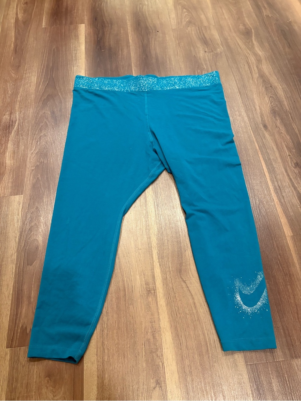 Nike woman’s Teal Capri Leggings with Glitter Waistband